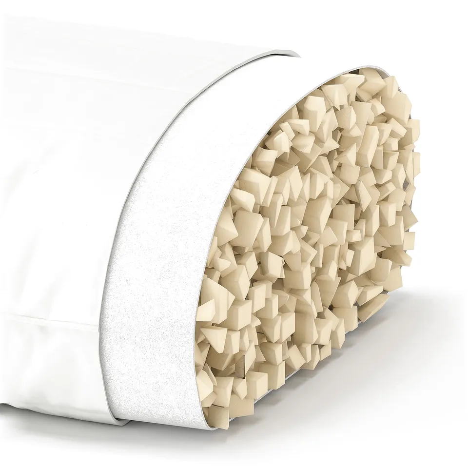 A white LÖKSTAMFLY pillow with shredded memory foam inside. Its cylindrical, ergonomic, and supportive for back and side sleepers.