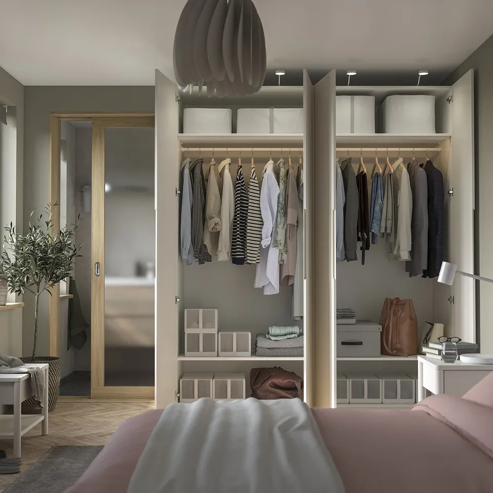 Modern bedroom with PAX wardrobe, clothes, shelves, bins, adjustable feet, and lighting.