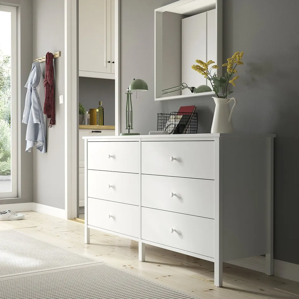 KILBERGET 6-drawer chest in organised room with lamp & mirror.