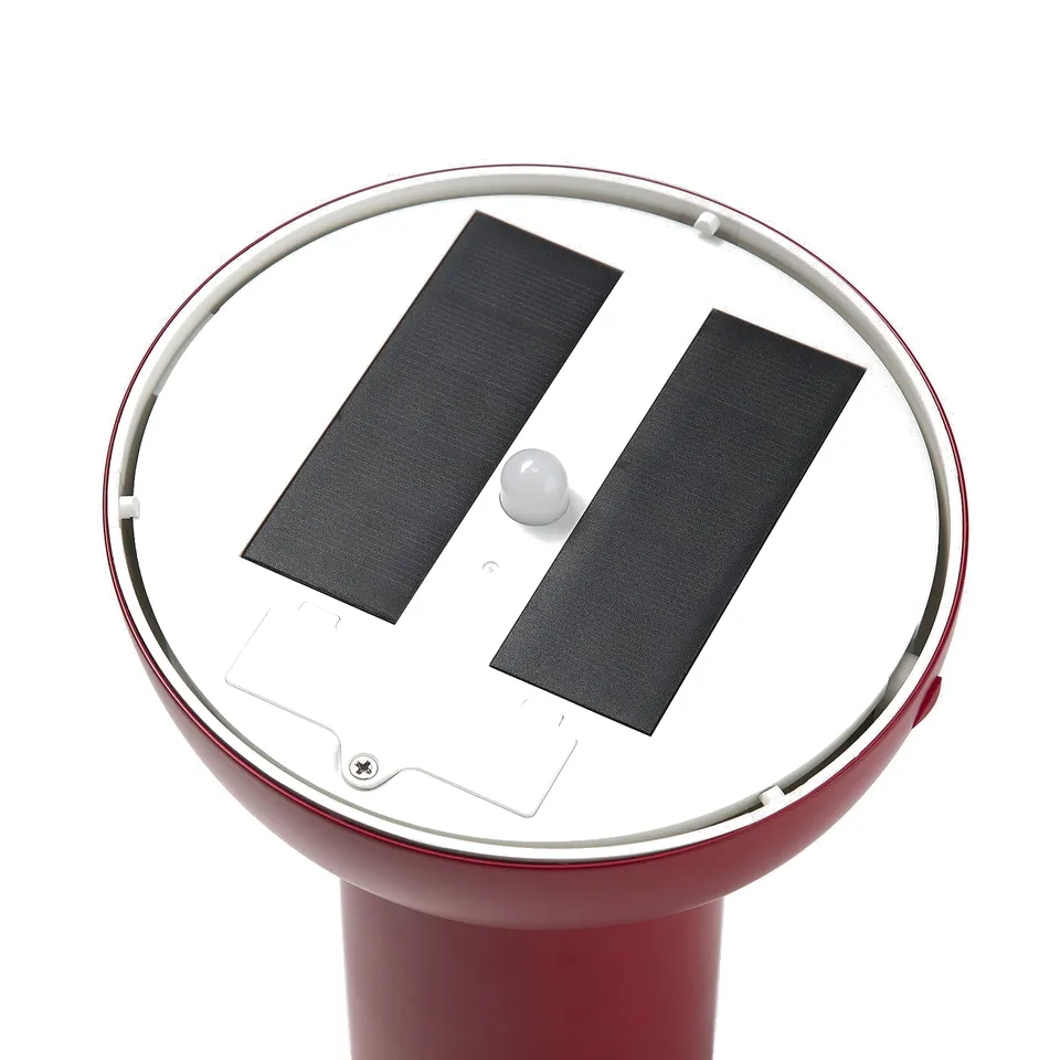 Red outdoor light with solar panels and a round base. Modern design, quality materials.