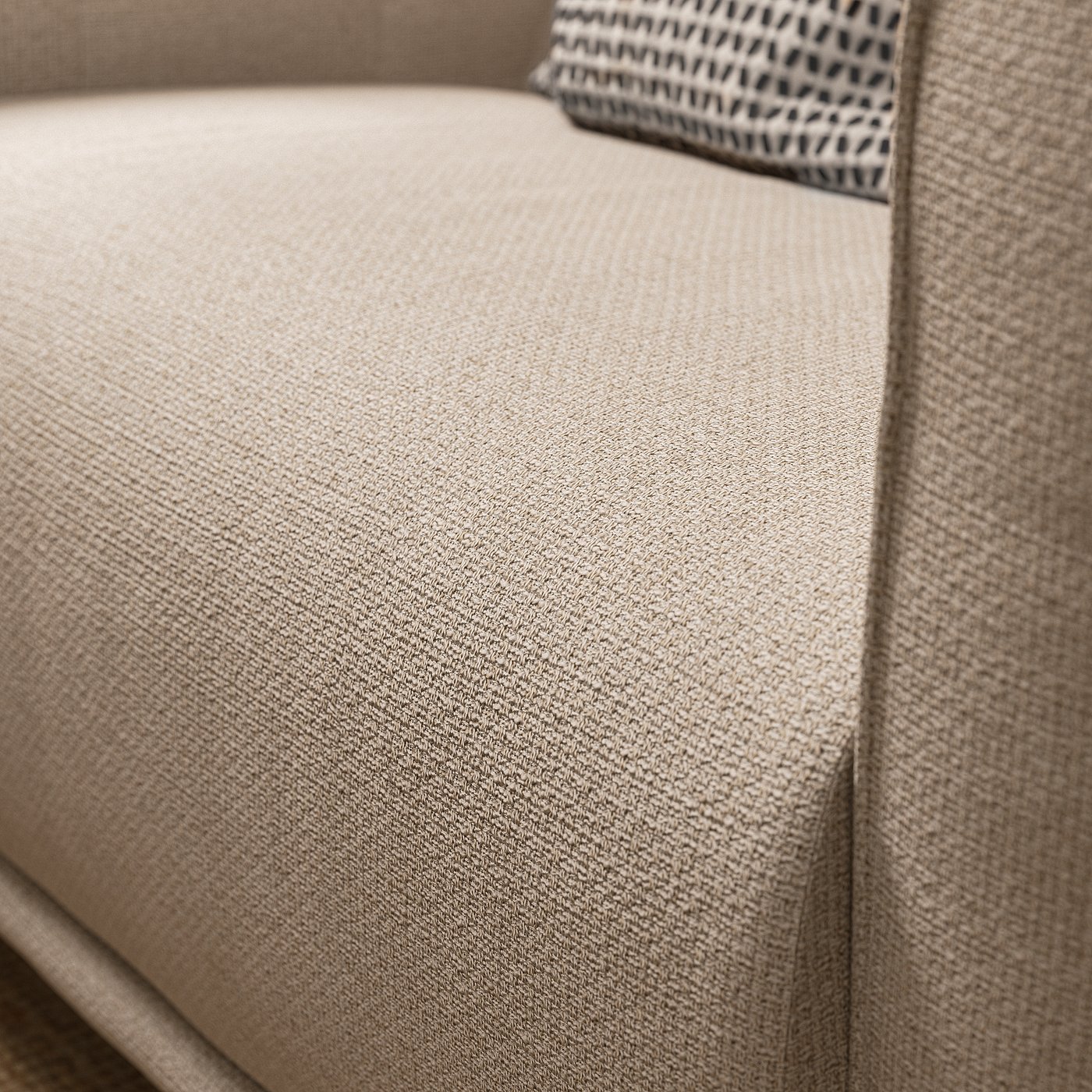 Close-up of VISKAFORS armchair in neutral fabric, showcasing its soft, rounded design and textured material.