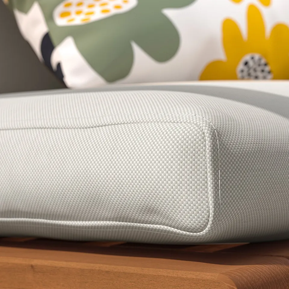 Close-up of a comfortable, outdoor seat cushion with grey mesh material, designed for durability.