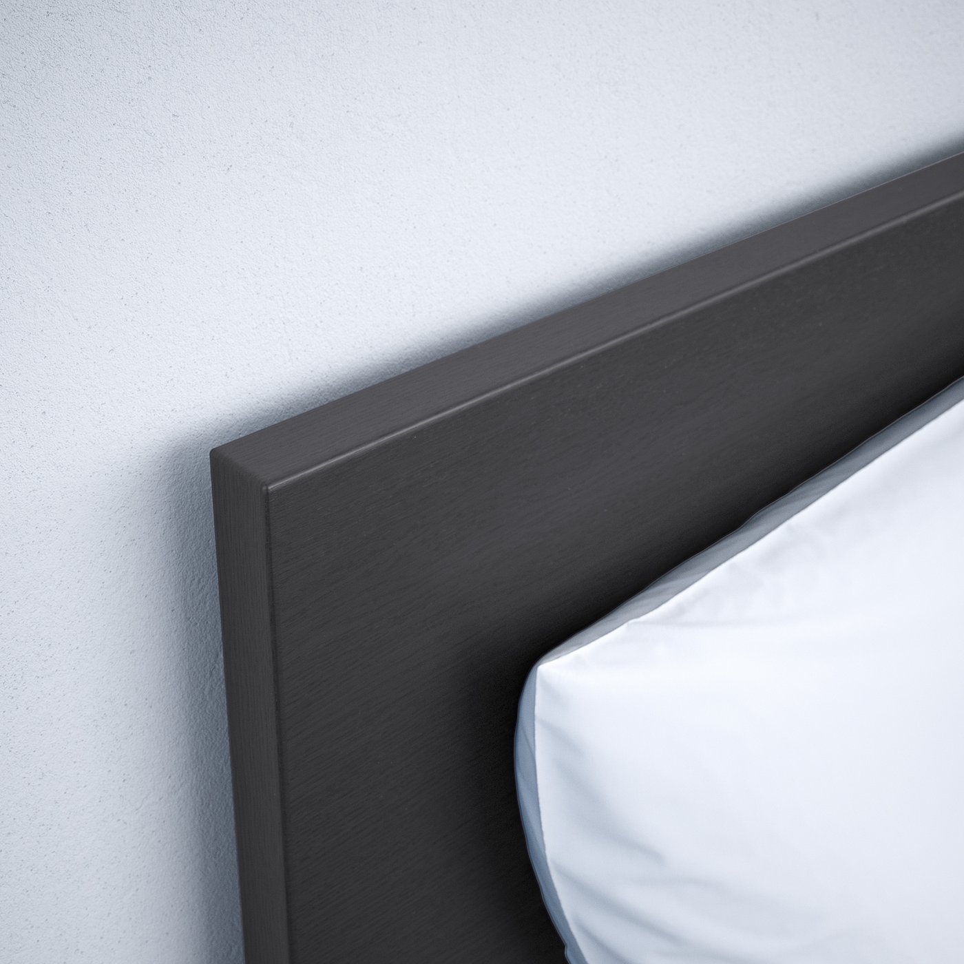 Black bed frame with sleek design and high headboard against light wall.