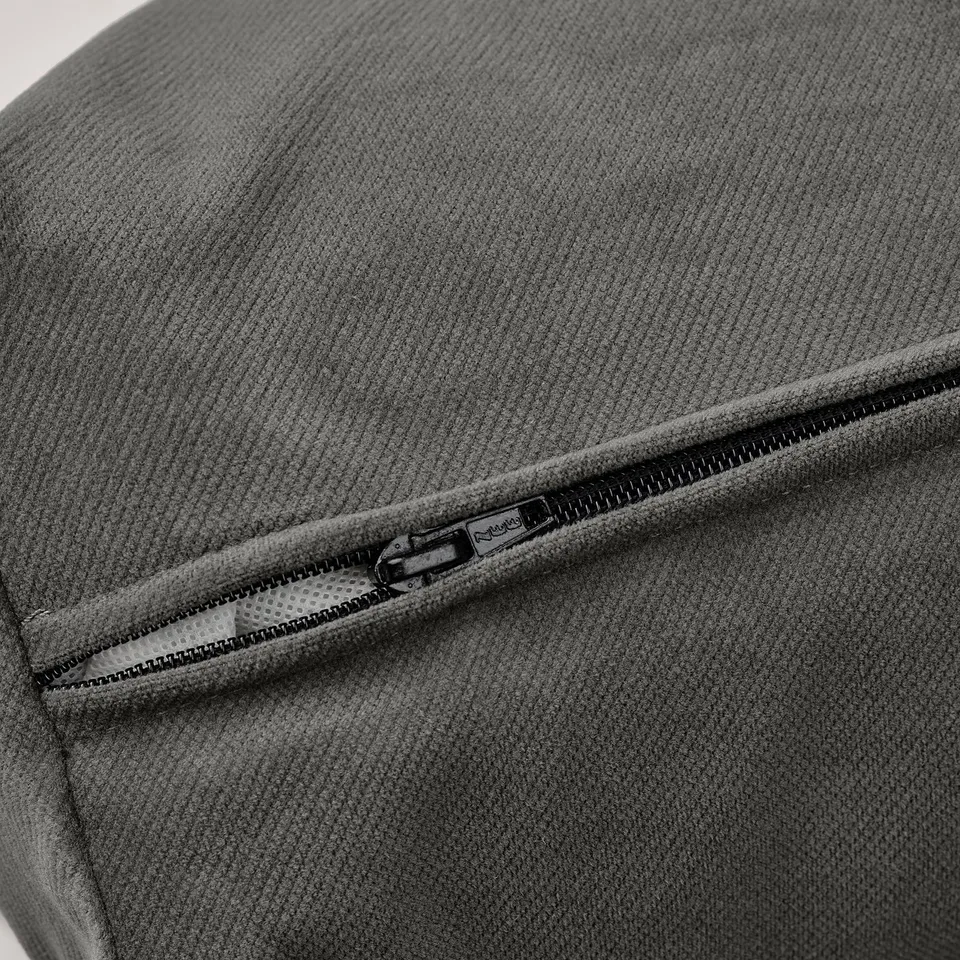 Close-up of grey fabric sofa zip detail; shows quality texture and stitching.