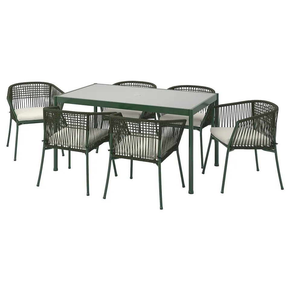 Modern green outdoor patio set: square glass table, four matching chairs with beige cushions.