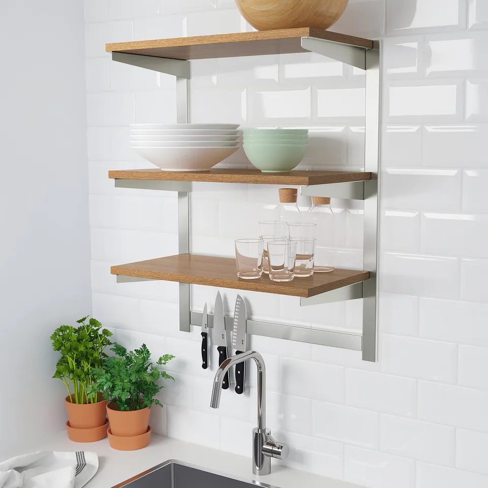 Kitchen shelves with bowls, glasses, and knives; wall-mounted, adjustable, and durable.