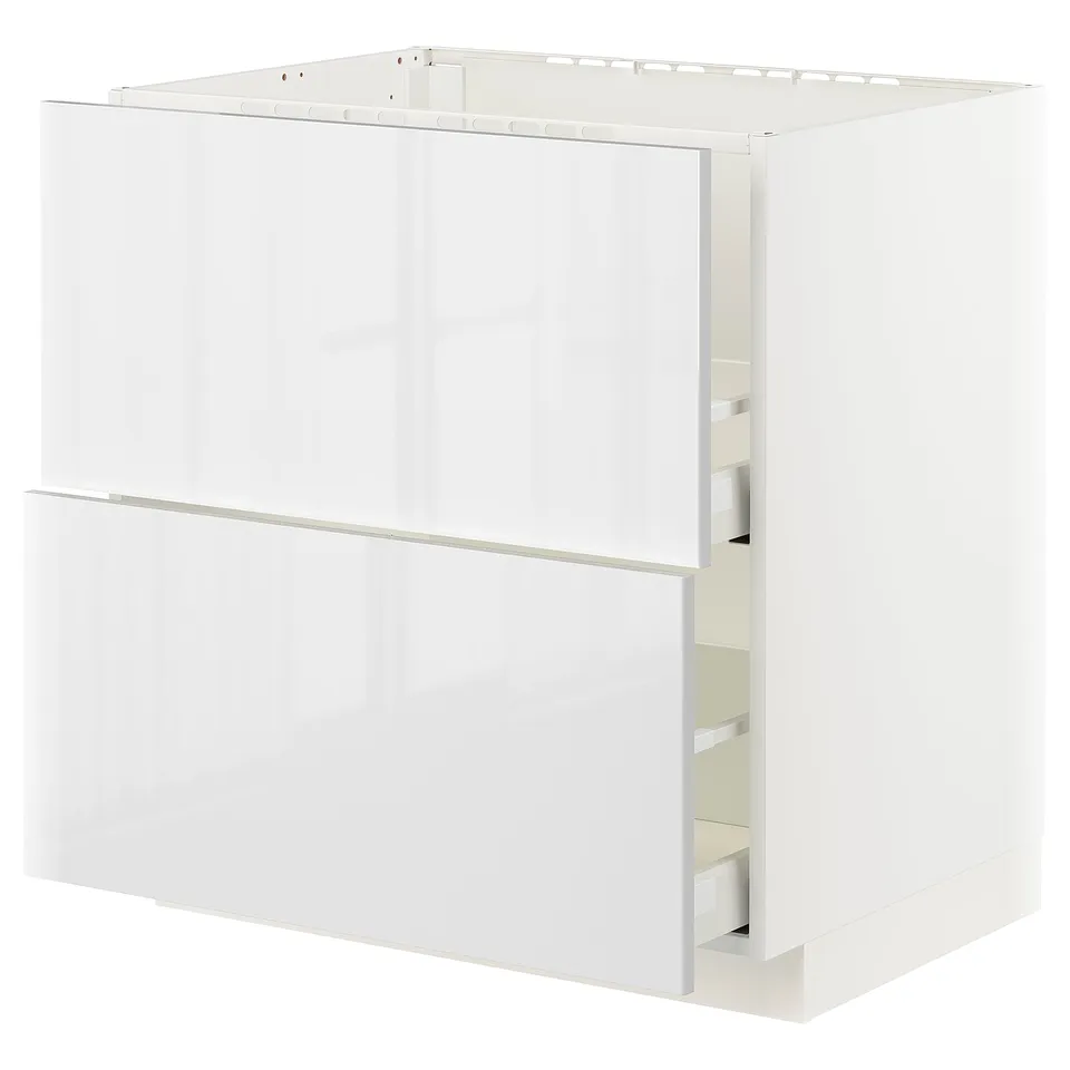 White METOD kitchen cabinet with high gloss drawer and smooth, sleek design.