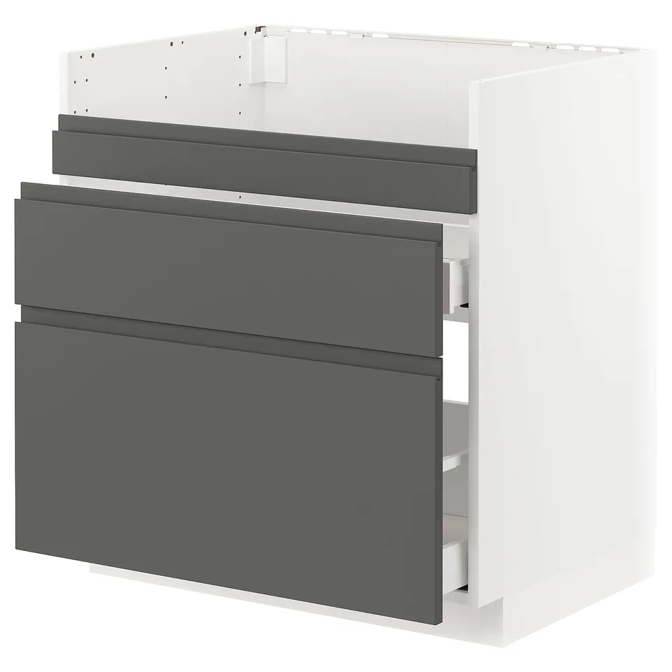 A modern kitchen cabinet in white with dark grey drawers, featuring a sleek and minimalist design.