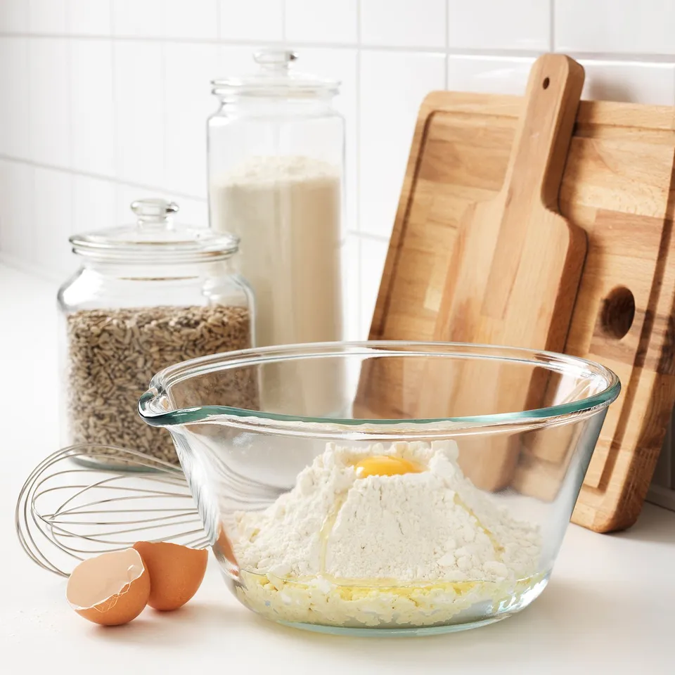Glass mixing bowl made of clear, durable material, perfect for combining ingredients. An easy-to-pour spout. Ideal for baking and cooking.