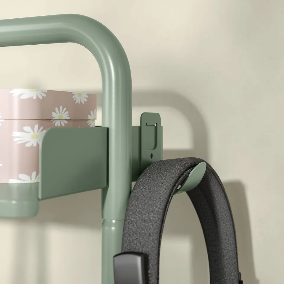Green RELATERA desk handle with black headphones hooked.