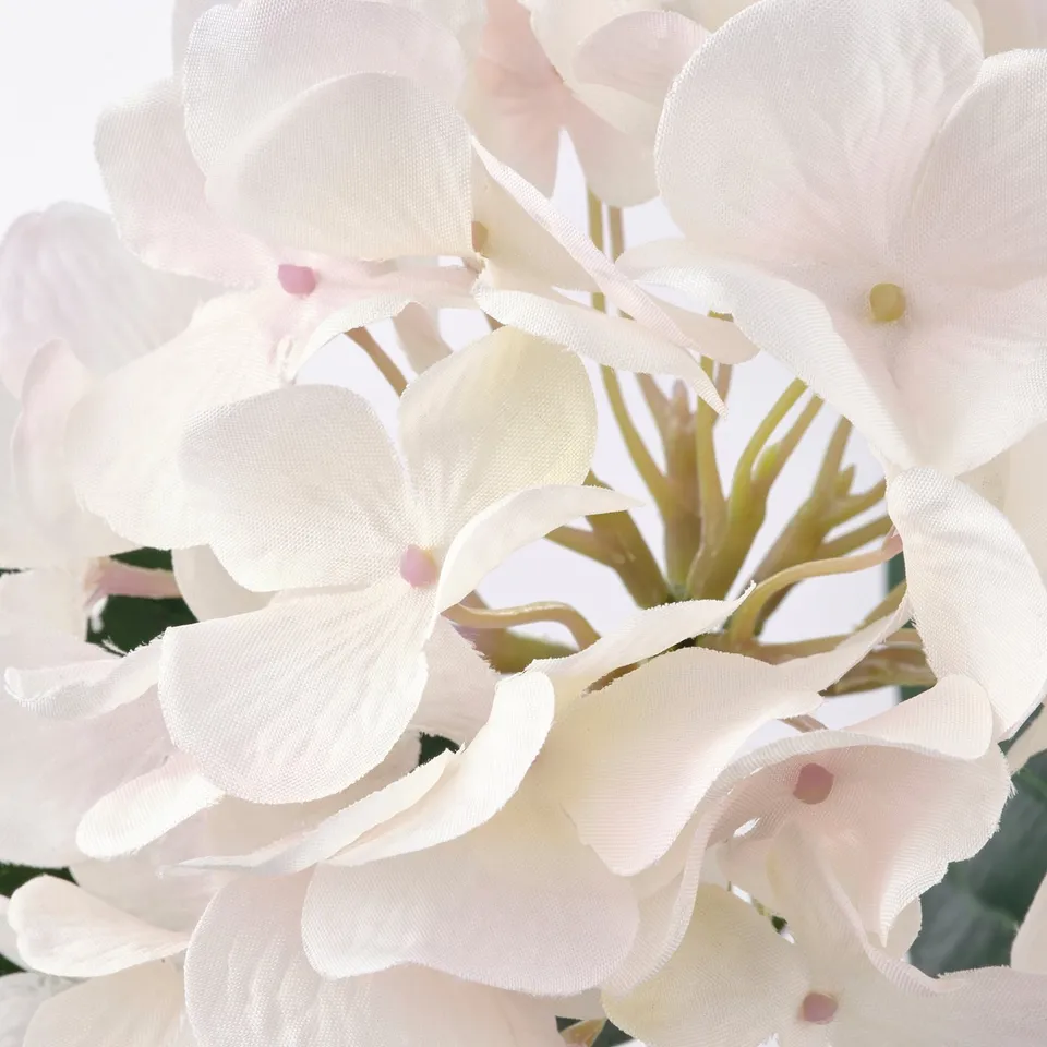 Beautiful artificial flowers clustered together, showcasing delicate petals and realistic texture.