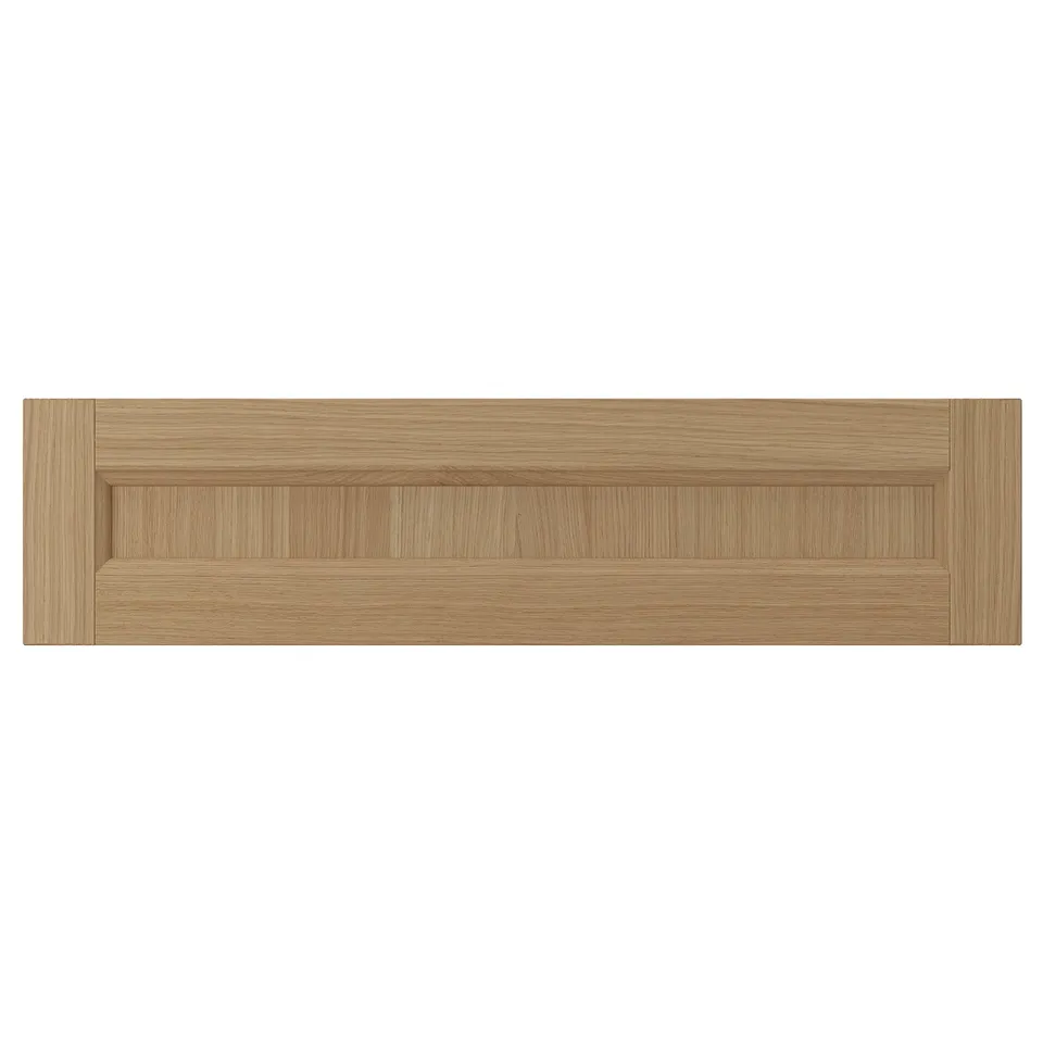 This is a wooden drawer front in natural oak. It solid oak frame with oak veneer panels. The design is modern with natural wood grain visibility.