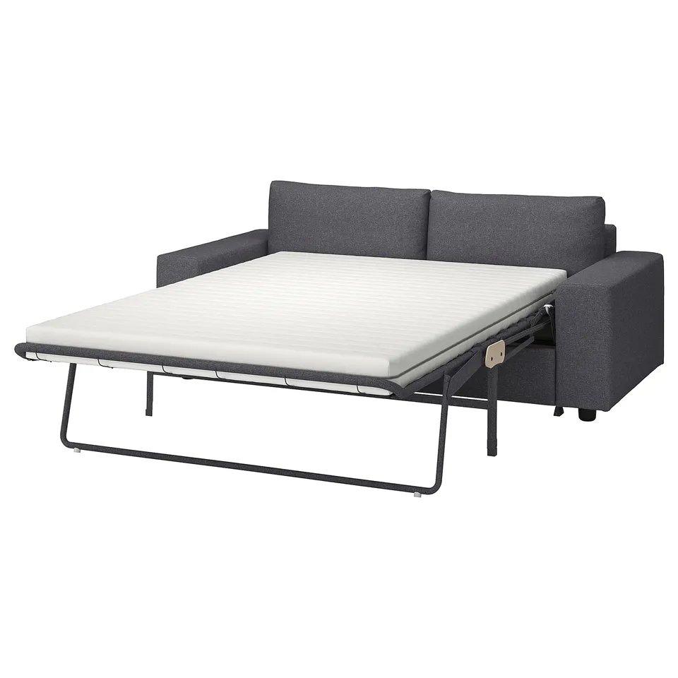 A VIMLE grey sofa-bed with a white mattress. It a modern design with a sturdy frame and comfortable cushions.