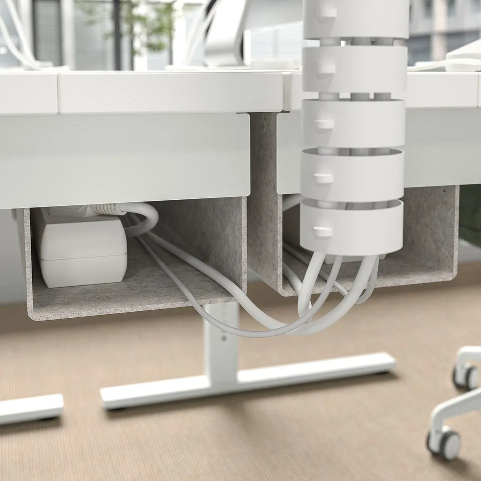 Desk with adjustable height settings and cable management tray, shown from below.