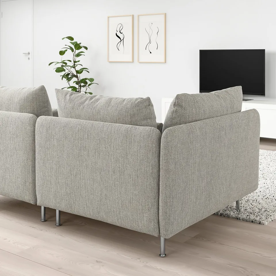 Modern living room with SÖDERHAMN sectional sofa, tv, art, and plant.