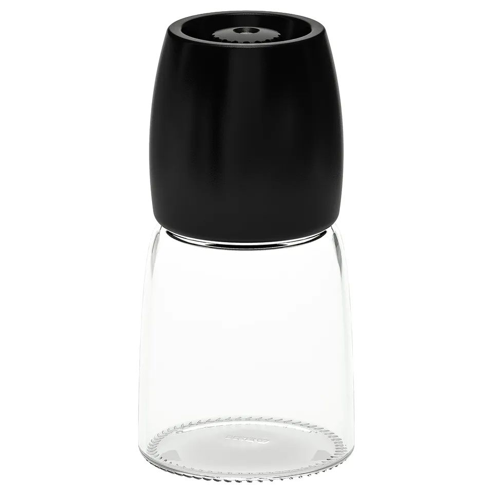 Ikea black pepper grinder, sleek glass & matte plastic, durable ceramic mechanism.