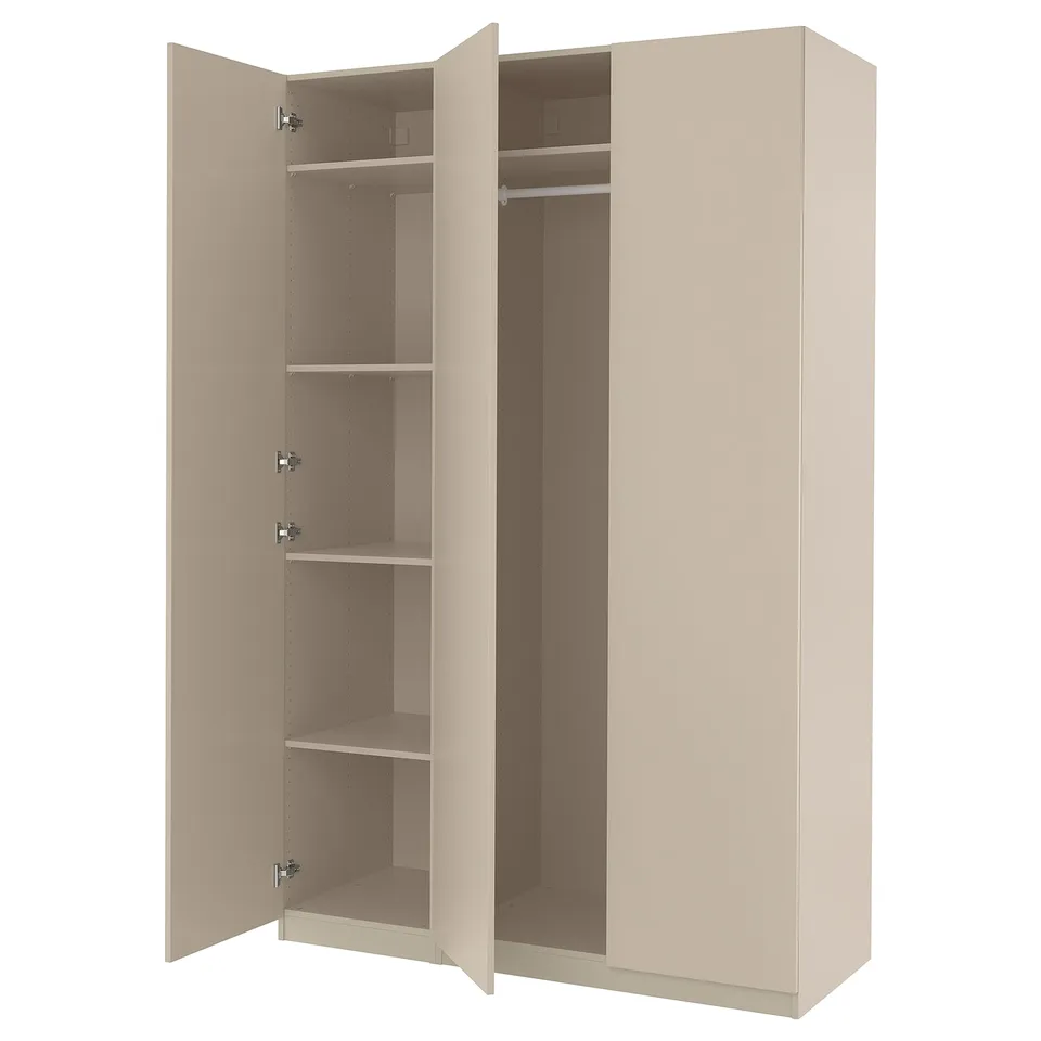 An open beige PAX wardrobe with shelves and a hanging rod inside.