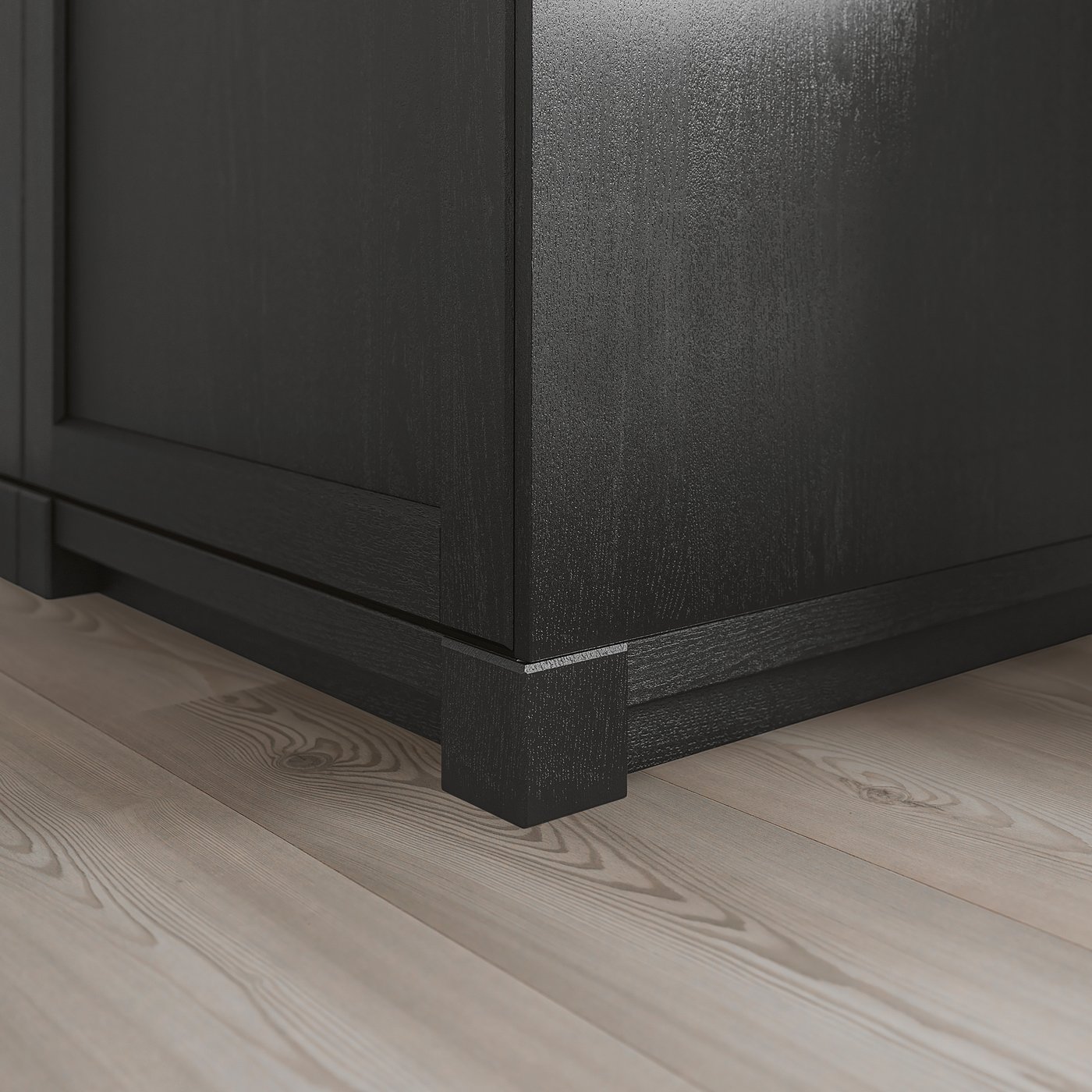 Black wooden cabinet leg, part of a kitchen set, providing support and rustic style.