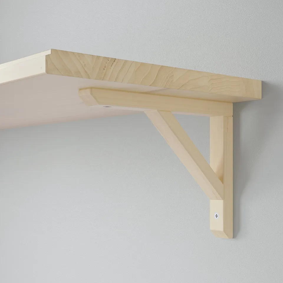 Light wooden wall shelf, elegant design. Mounted with angled brackets, ideal display or storage.