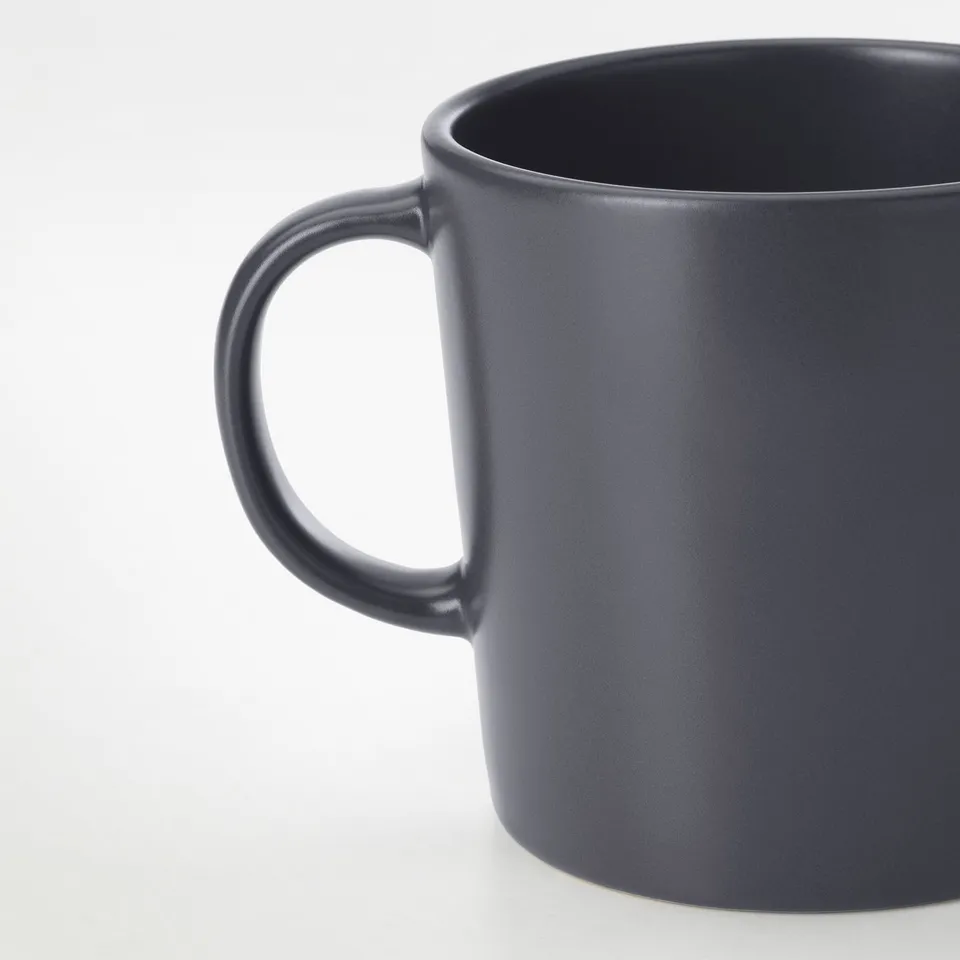 Dark grey stoneware mug with smooth, matte finish and sturdy handle.