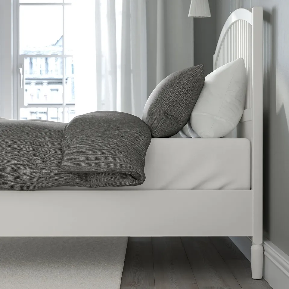 Bed with neat, adjustable sides for varied mattress thickness. High headboard for comfortable sitting. Space under bed for storage.