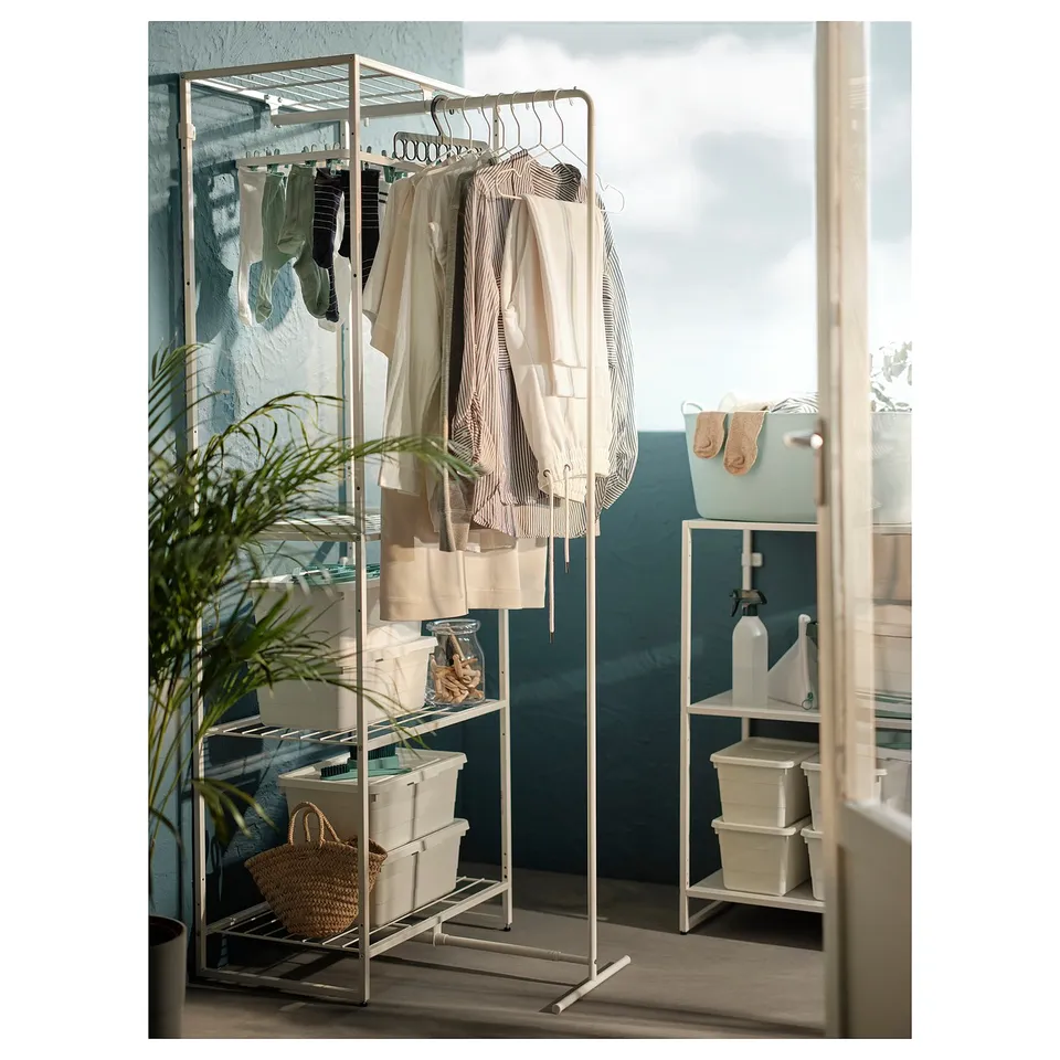 Rya JOSTEIN laundry organiser with drying rack, white metal, holds clothes, baskets, and plant.