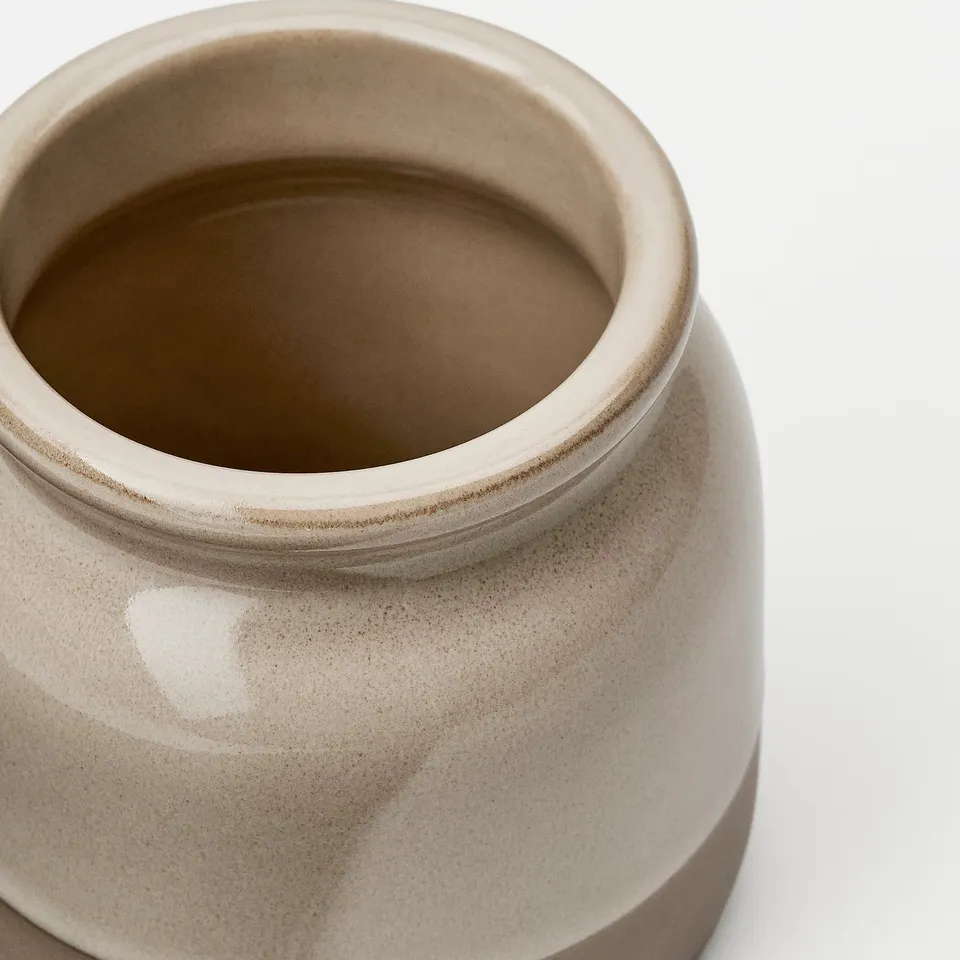 Crafted jar with smooth, glazed finish showcasing quality stoneware, perfect for kitchen display or storage.