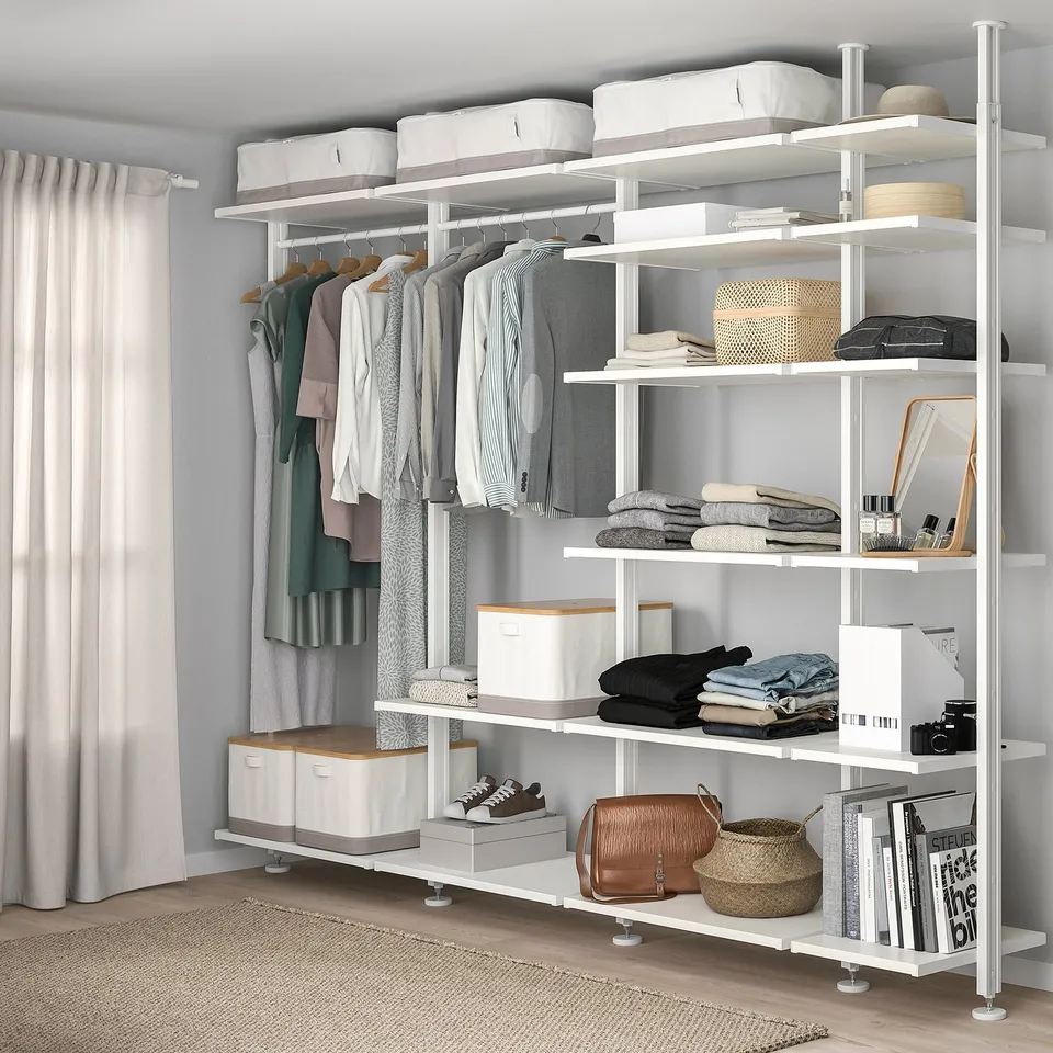 ELVARLI storage system with clothes rail, adjustable shelves, and various items.