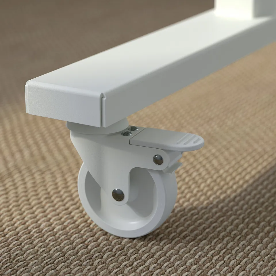 Close-up of a white, sturdy caster wheel attached to a foldable tables leg, showcasing its durability and mobility.