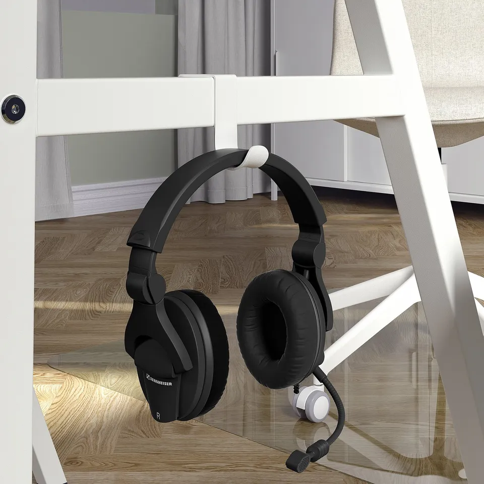 A headphone hook on a modern, small, white desk with a wooden floor, ideal for compact spaces.