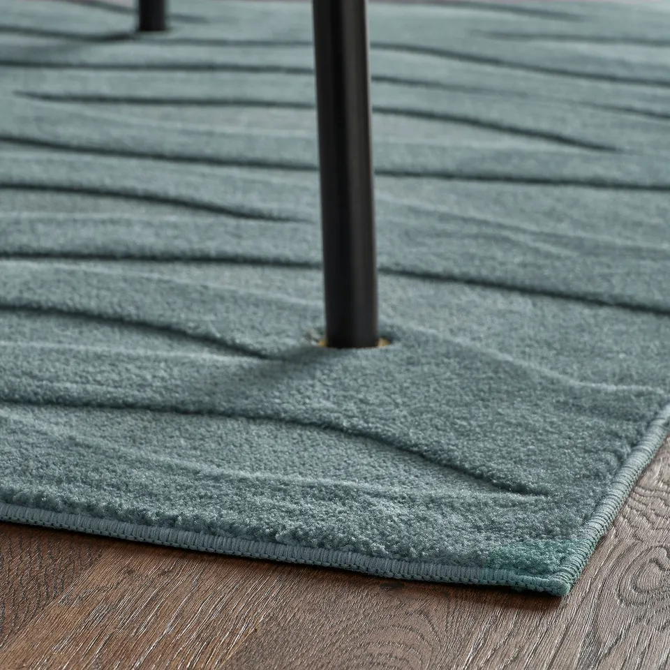Blue, textured rug, low pile, folding, easy to clean.
