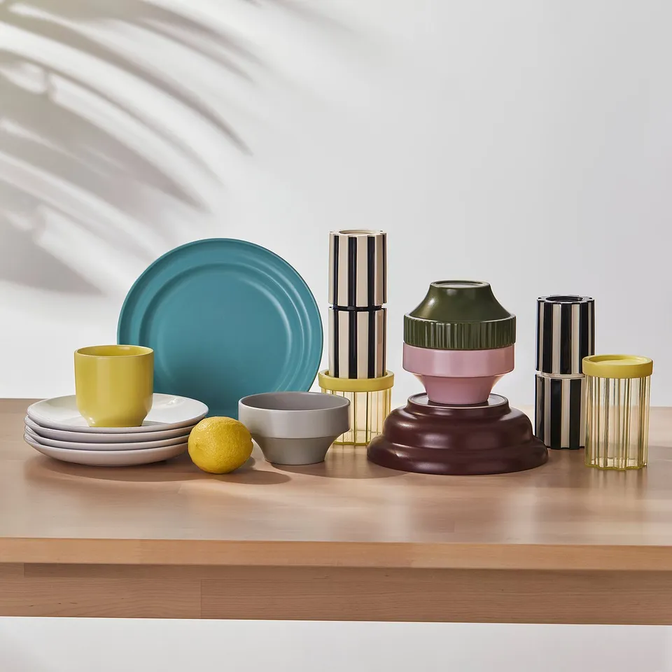 Colourful jars on wooden table for storing and showcasing dry goods.
