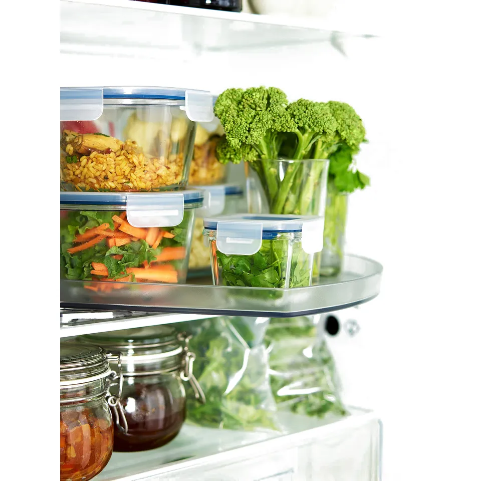 IKEA 365+ glass containers with clear lids storing vegetables in fridge, organised in layers.