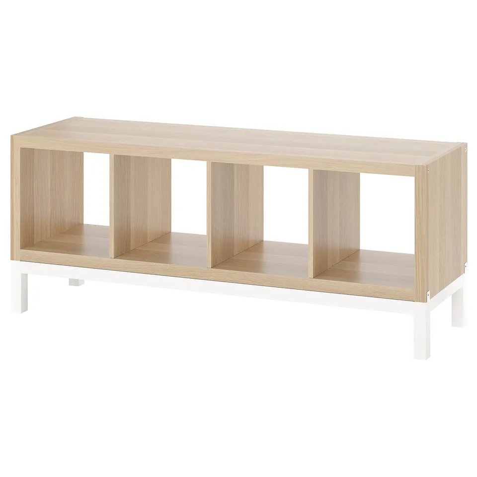 Empty light KALLAX shelf, 4 open sections, white base.