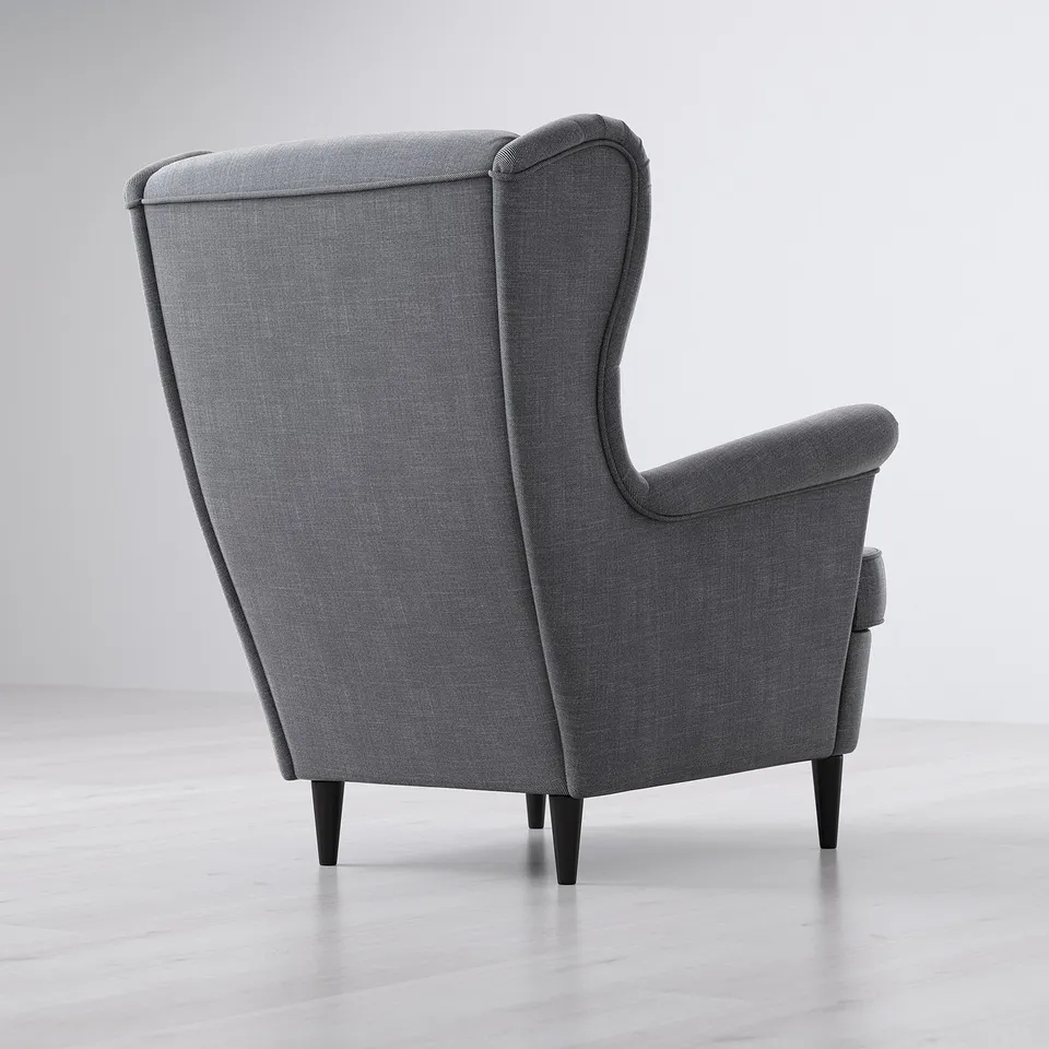 A grey, high-backed armchair with wooden legs, designed for comfort and support, situated against a plain, light-colored background.