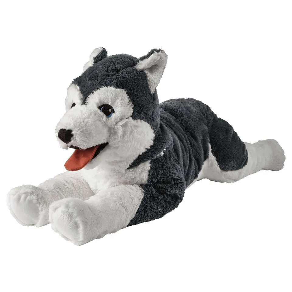 A grey and white plush husky, lying down with its tongue out. It has bright blue eyes and soft, fluffy fur. Ideal for cuddling.