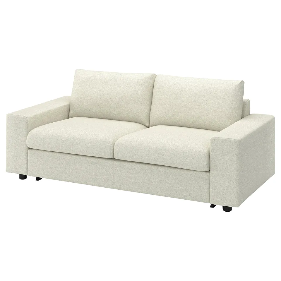 A VIMLE light beige sofa with a sleek, modern design. Its upholstered in gunnared polyester fabric and supported by black legs.