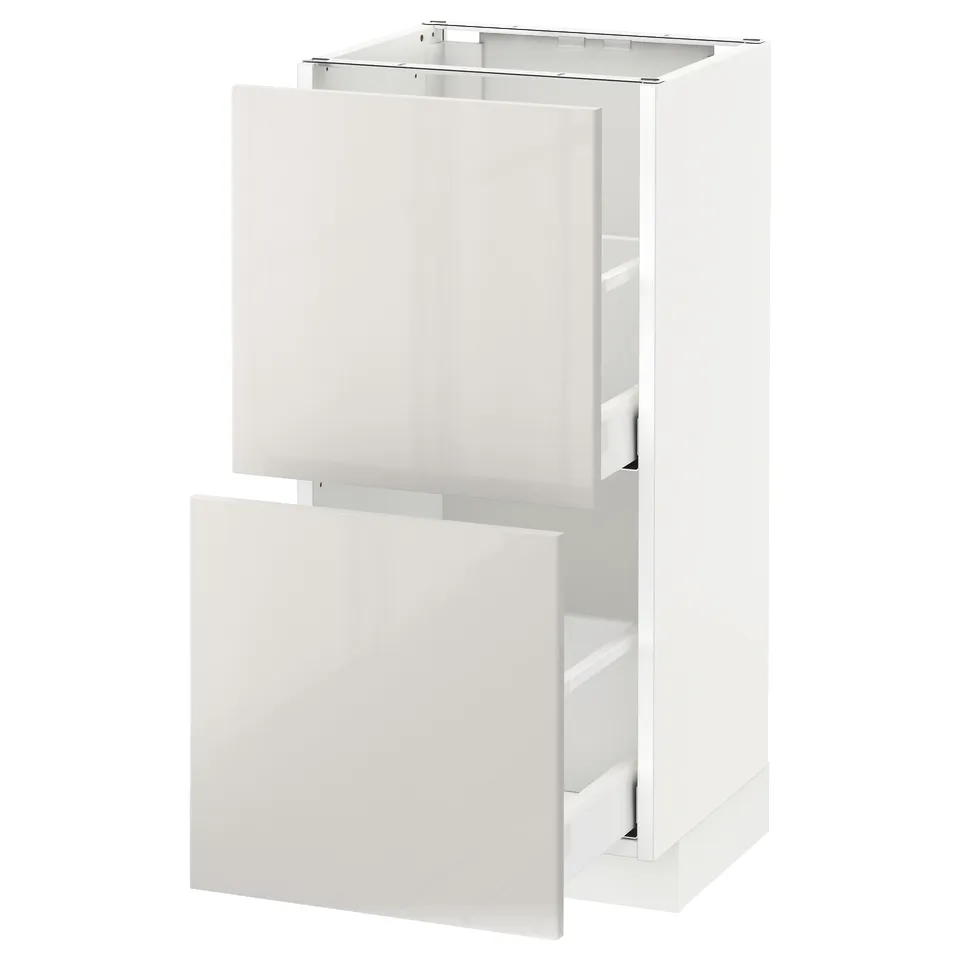 A white METOD kitchen cabinet with high-gloss, smooth surfaces and a sleek, modern design.