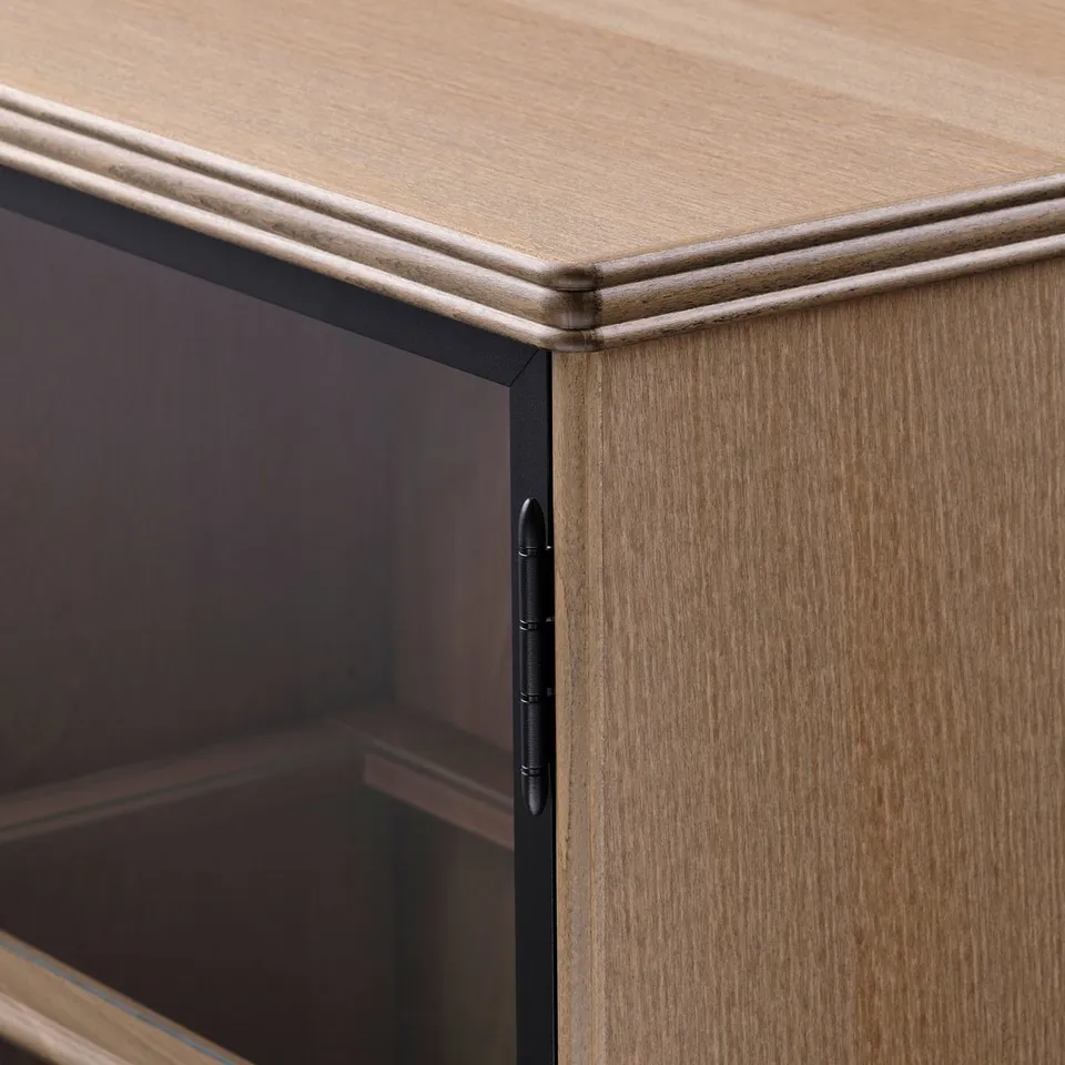 Close-up of a well-crafted wooden cabinet. Notice smooth edges, sturdy construction, and sleek metal hinge detail.