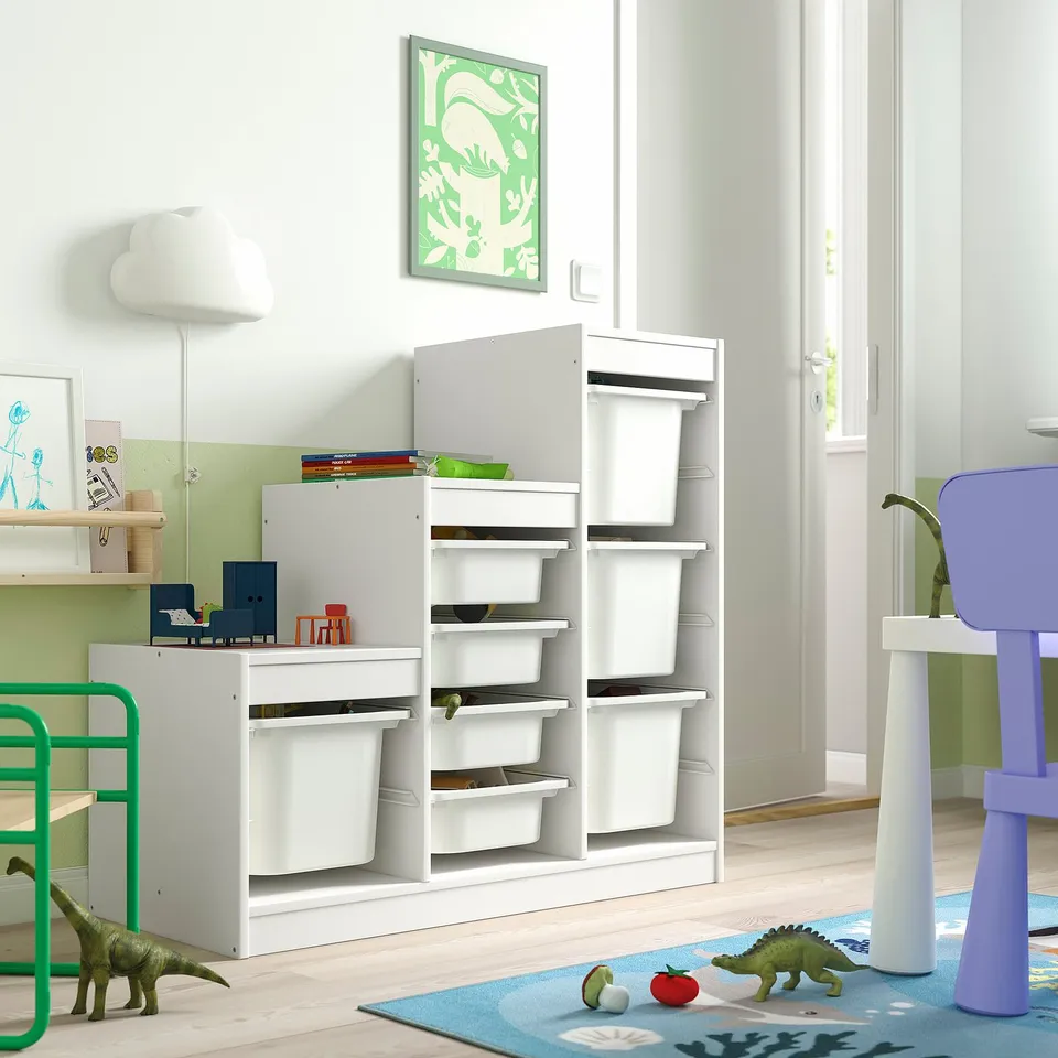 Kids room with TROFAST storage, toys, dinosaurs. Bright, modern.