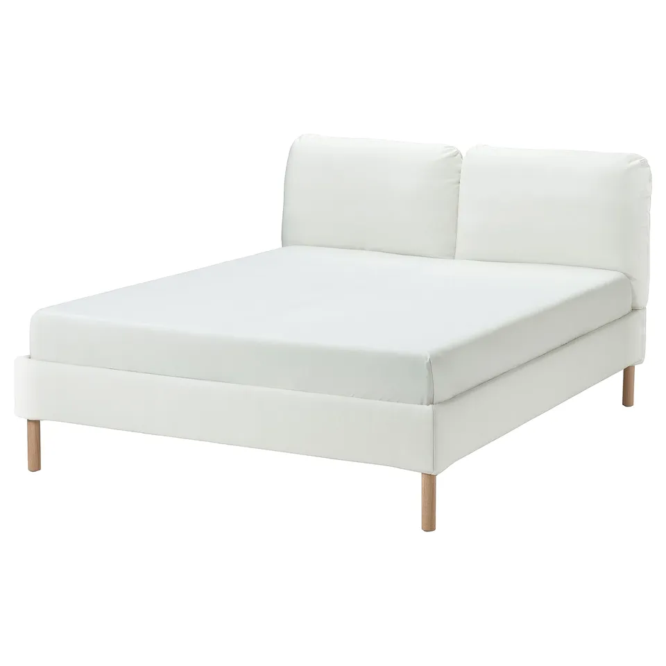 SAGESUND bed, white with wooden legs, upholstered, modern design.