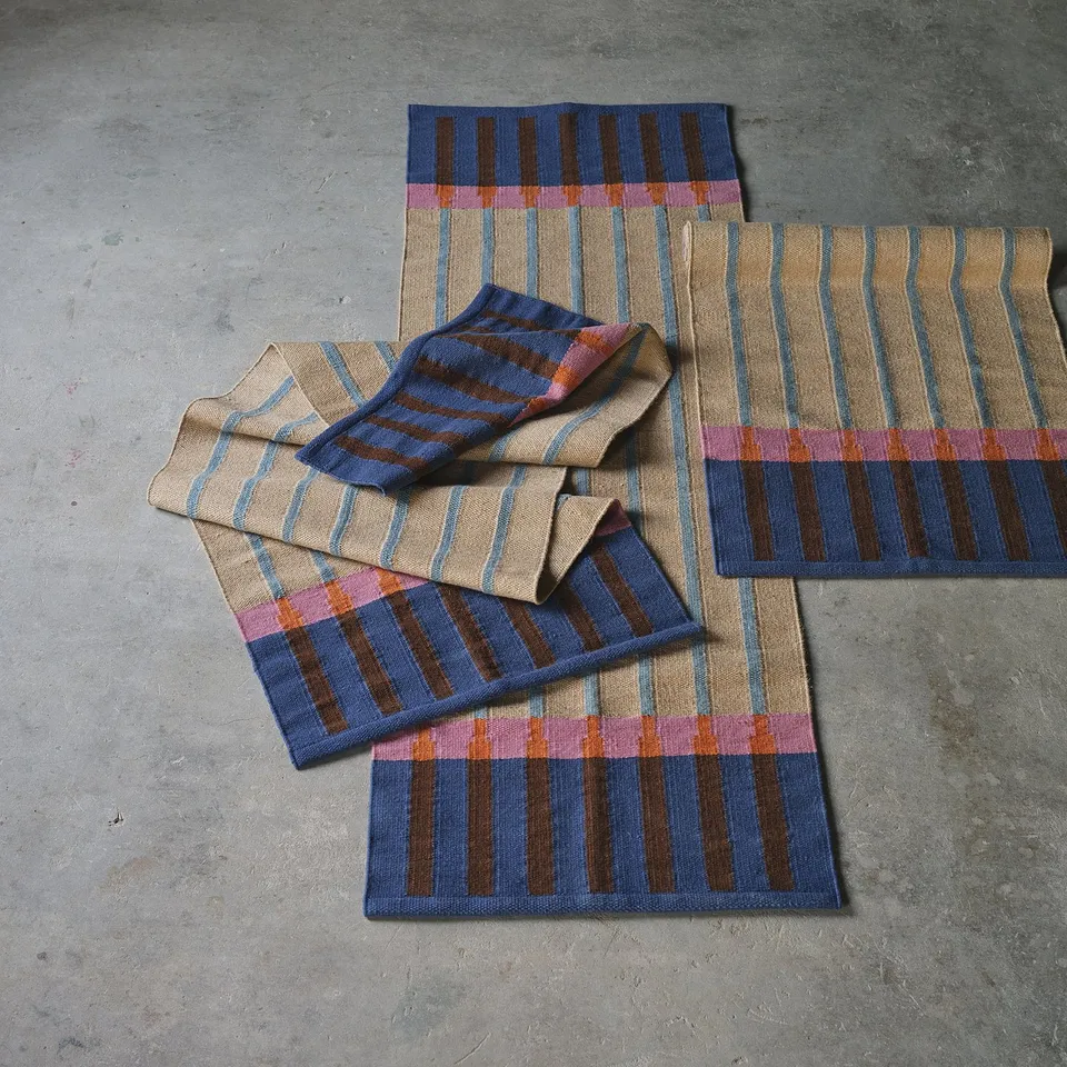 Colourful MÄVINN rugs in hallways or bedside, striped jute with wool accents.