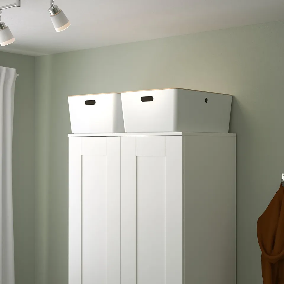 White KUGGIS storage box on shelf. Large, recycled plastic with side handles.