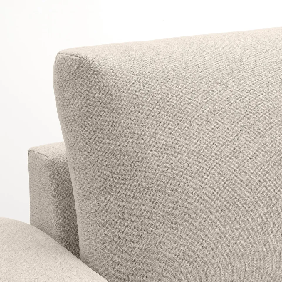 Modern sofa with sleek lines and plush cushions, showcasing fine upholstery.