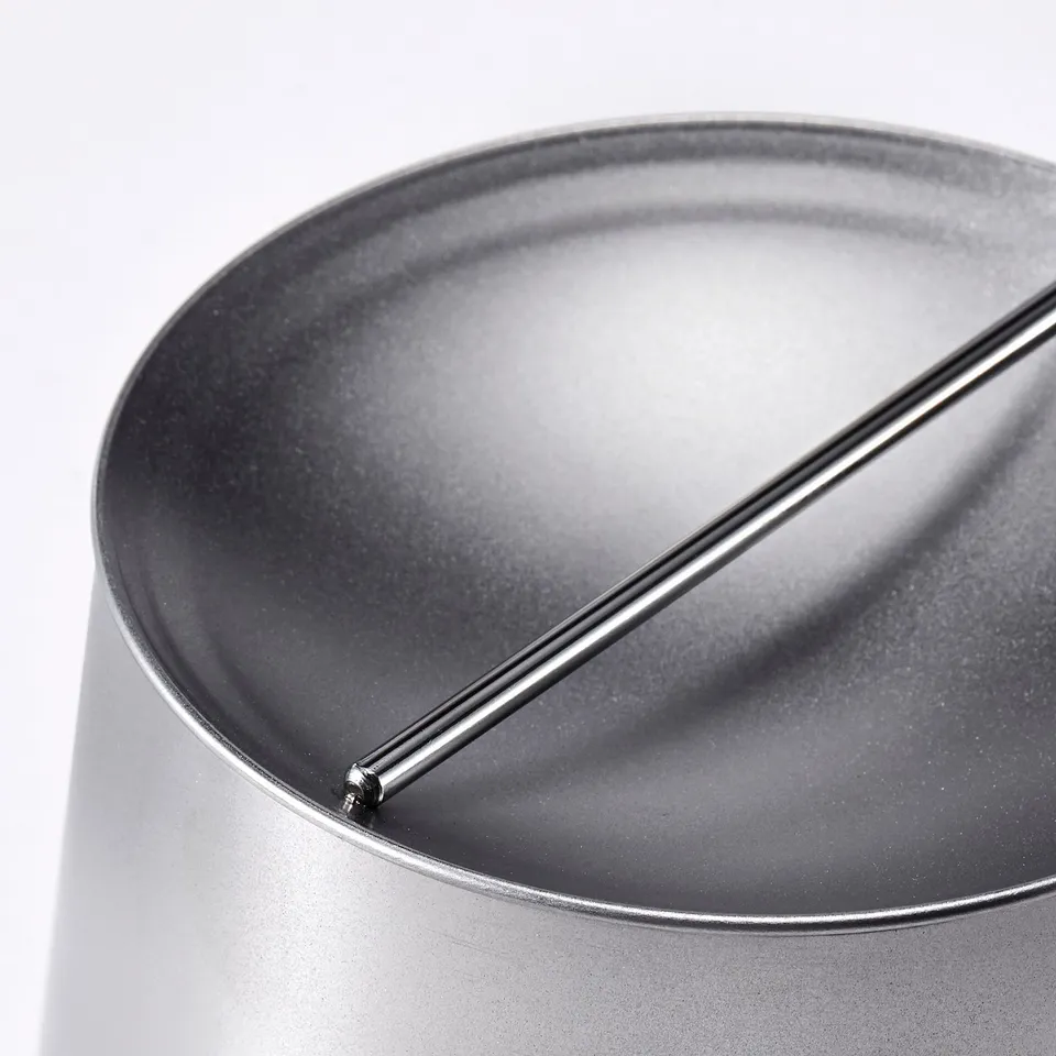 Modern metallic jar with lid, sleek finish, robust steel construction, tight seal for freshness.