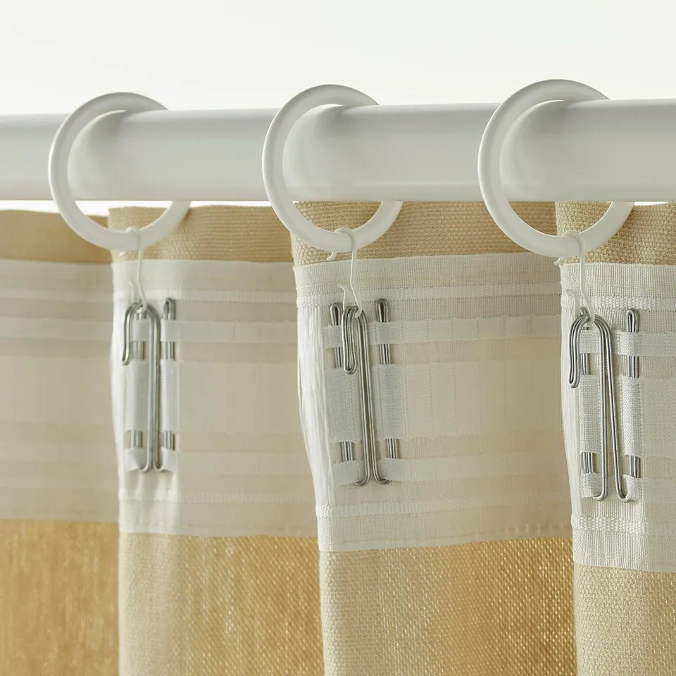 White curtain rings with hooks and clips for easy hanging.