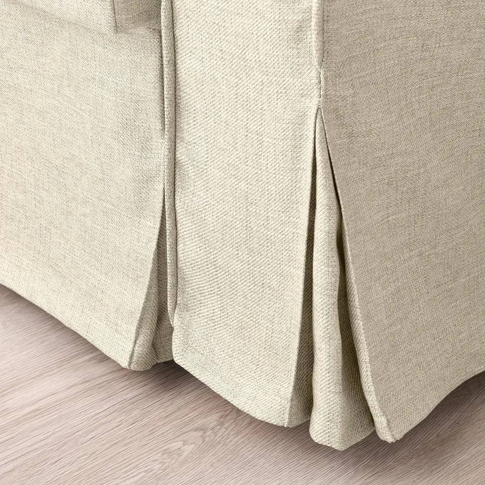 Close-up of VRETSTORP sofa-bed, showcasing smooth, durable fabric and neat stitching.