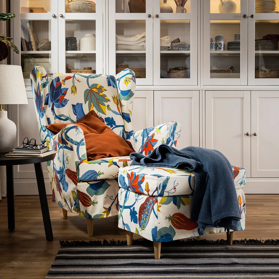 Bright floral pattern chair, white background, modern design, large.