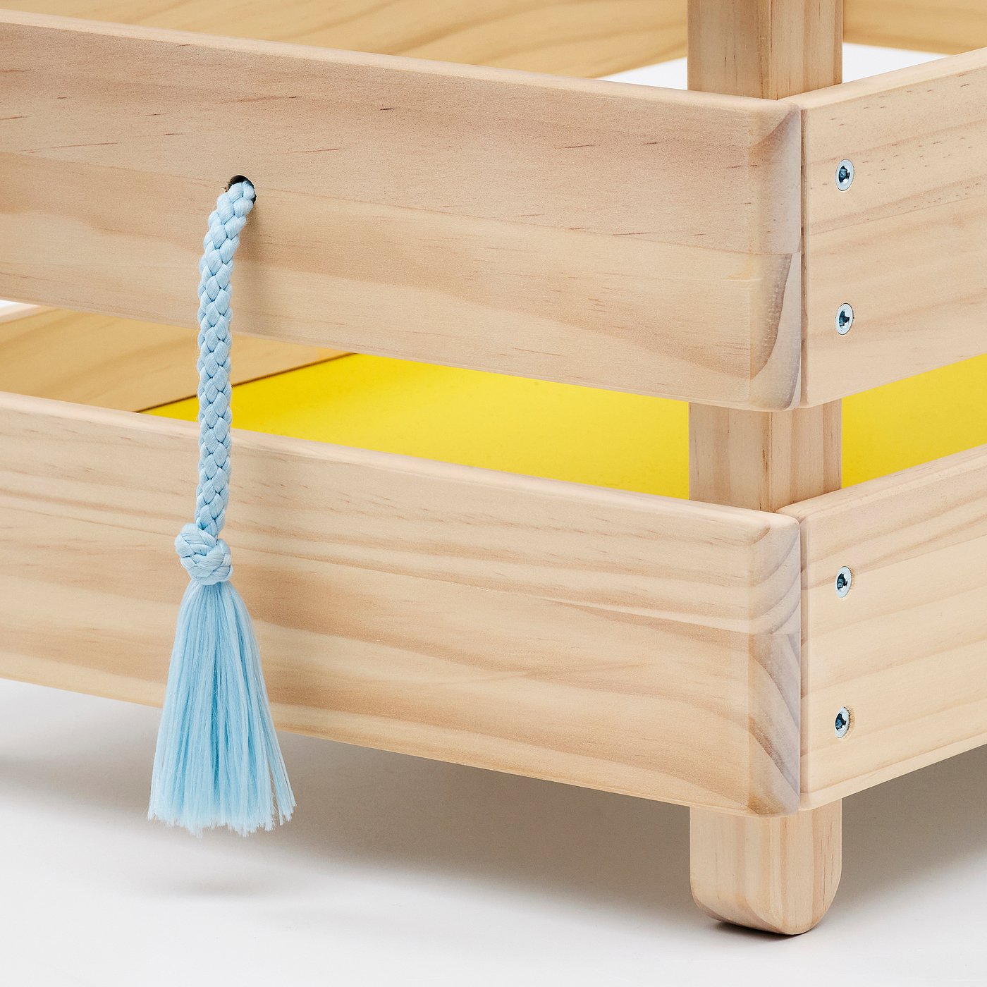 Wooden toy storage with light blue decorative rope handle, bright yellow accents, and wheels. Solid construction, natural wood finish.