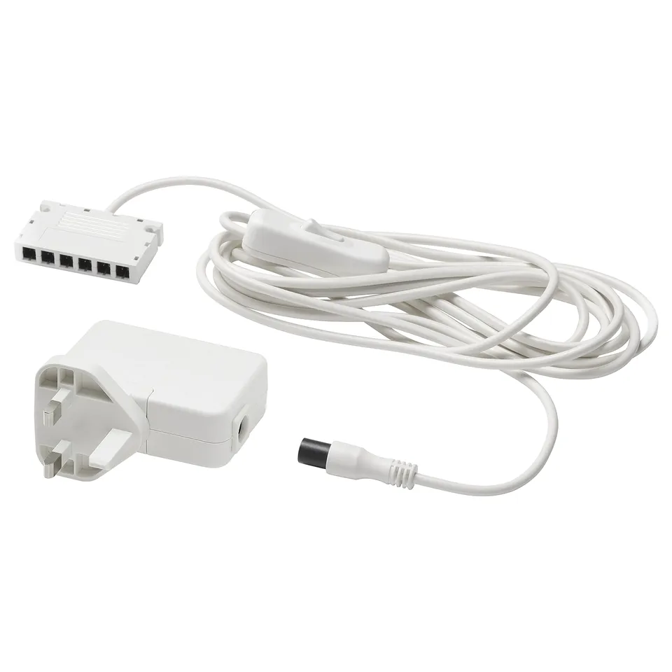 White ikea ANSLUTA power cord set for controlling up to six lights with one switch.
